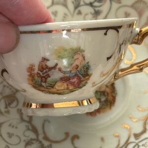 Elegant Gold and Cream Teacup with Artwork . Porcelain tea cup .